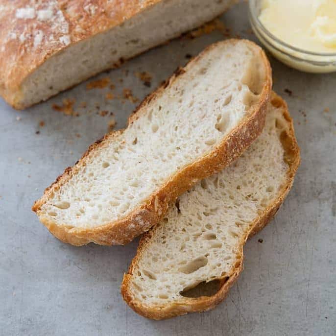 A close-up of the bread's airy crumb and fragrant rosemary