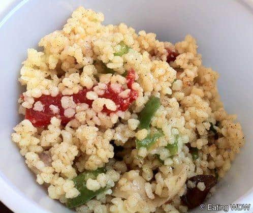  A vibrant and colorful bowl of Epcot's Moroccan Couscous Salad.