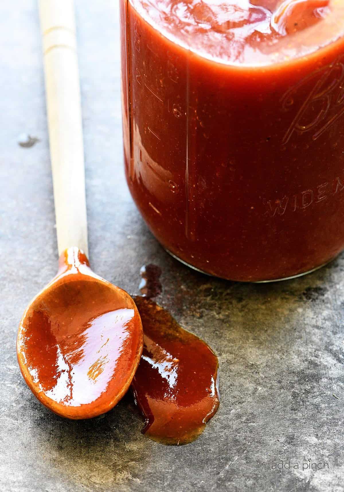  Brushing on the homemade Sugar Shack Barbecue Sauce to add flavor to grilled chicken