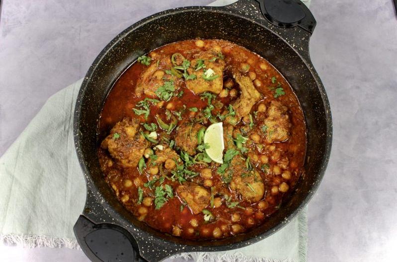  Juicy chicken pieces and chickpeas simmered in a spicy tomato and onion masala