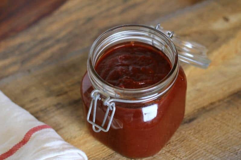  Mixing up a batch of Sugar Shack Barbecue Sauce with a wooden spoon and a smile