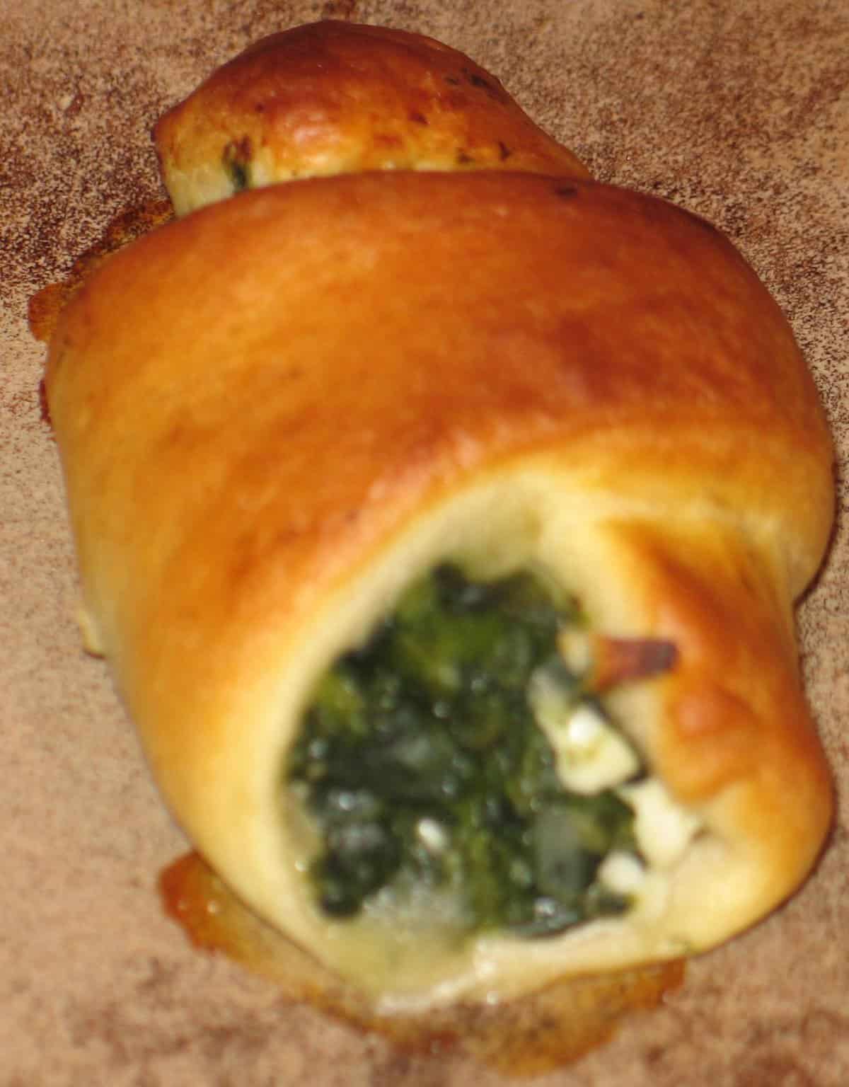  The flaky, buttery dough of these crescents is the perfect complement to the savory spinach and feta filling.
